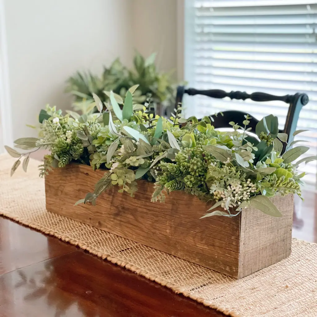 Muted greens in box with tan table runner