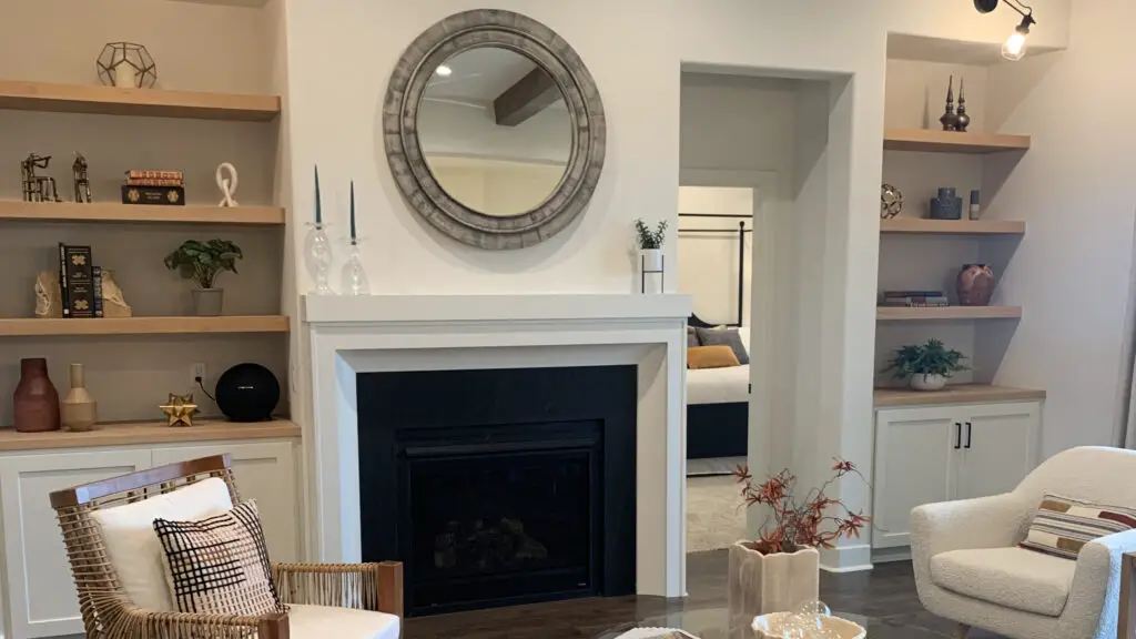 White wall with fireplace and built ins