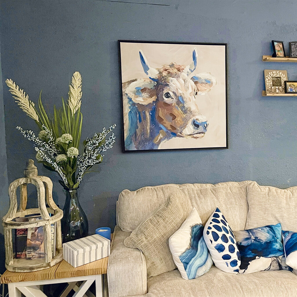Cow painting, with side table and table top decor