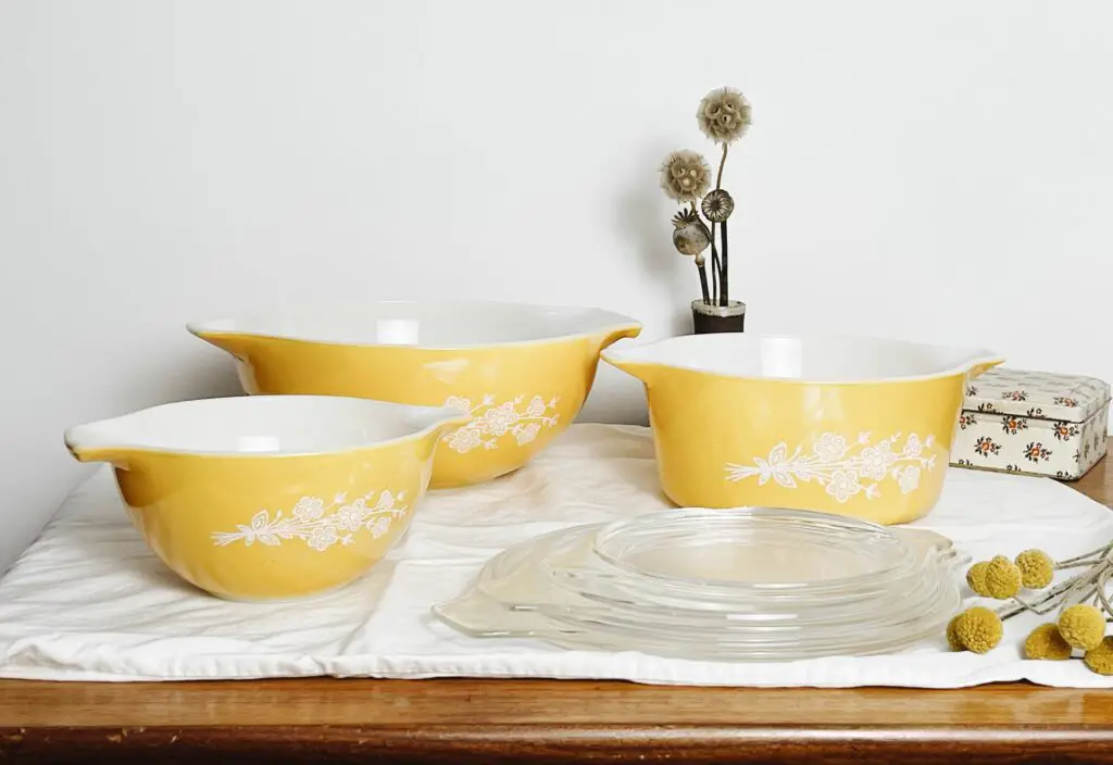 yellow pyrex bowls on table