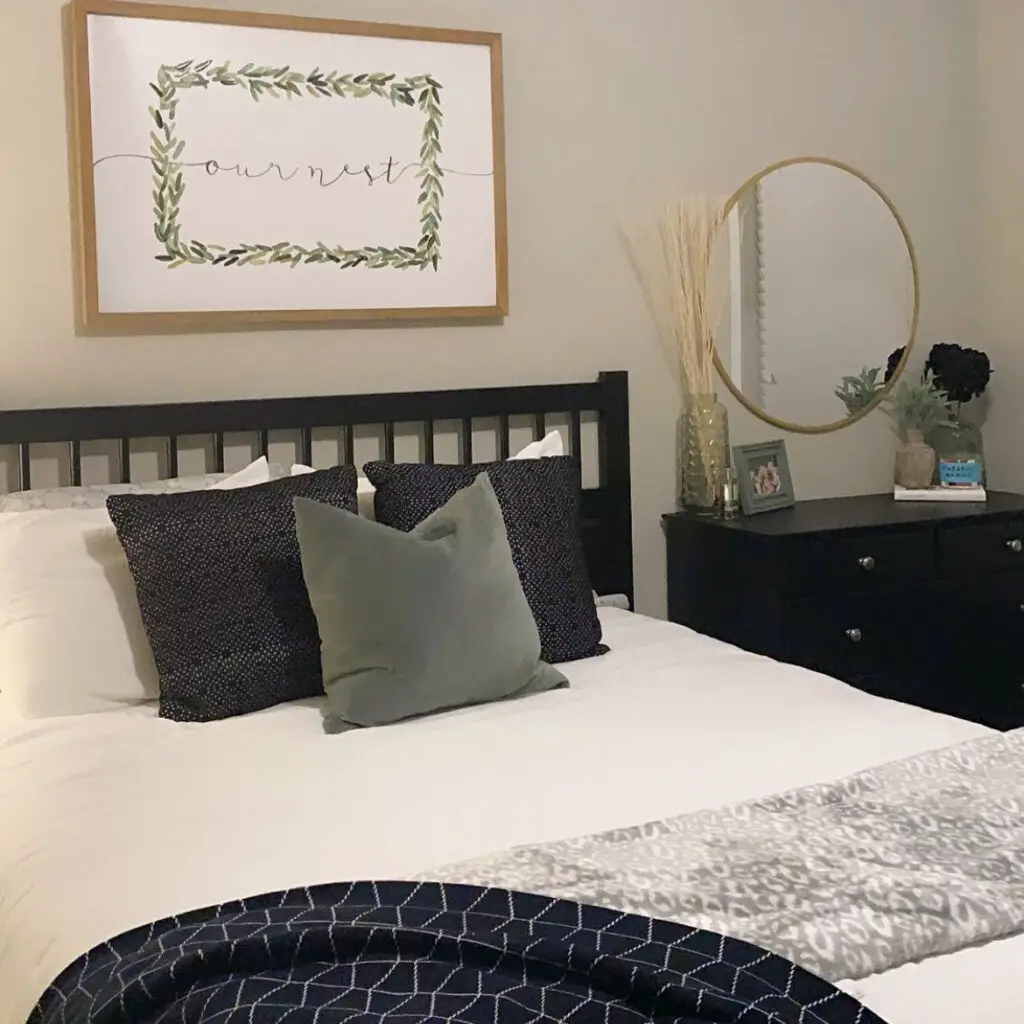 Black, white, grey and green bedroom bedding & dresser decorations.