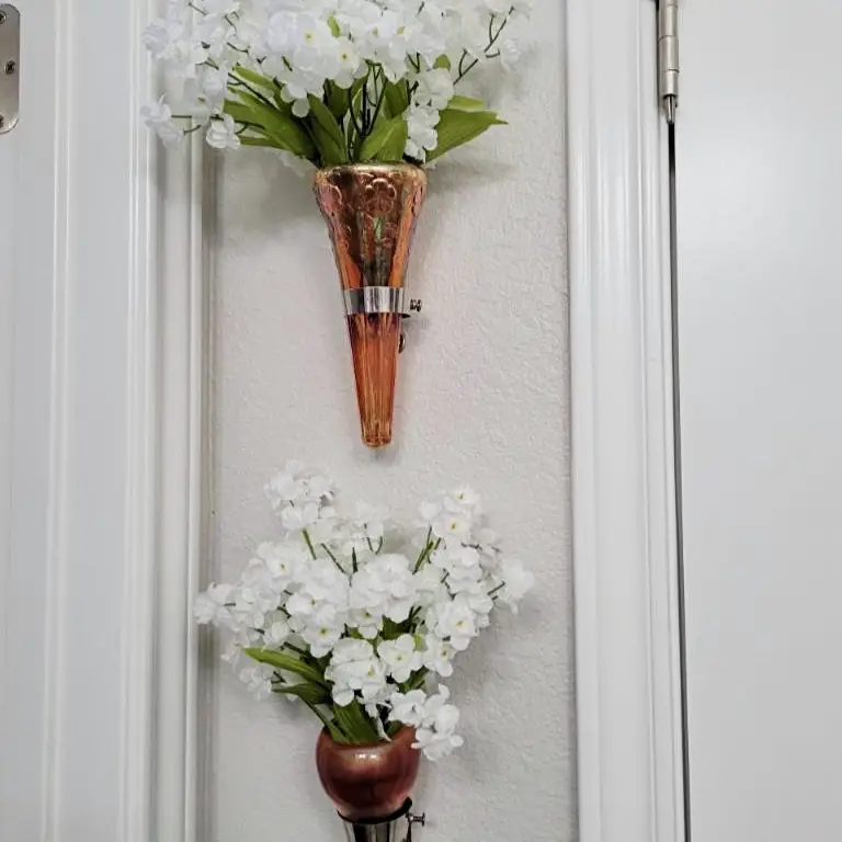 antique vases hung on the wall