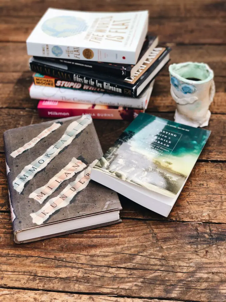 books on table with mug