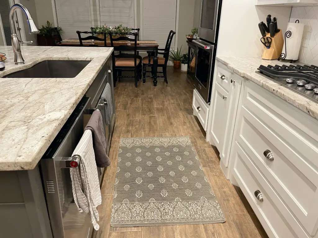 grey and white rug in kitchen