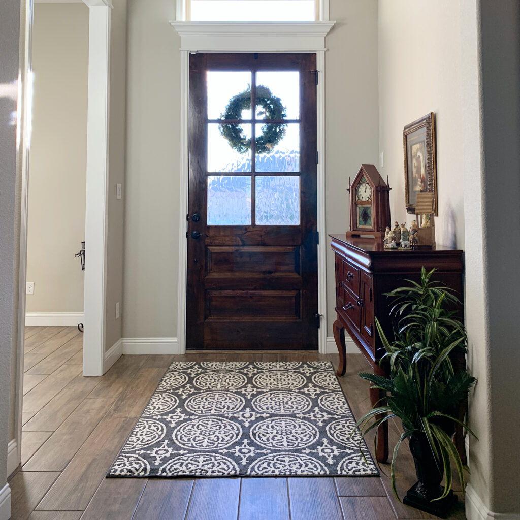 grey and white patterned entry way rug