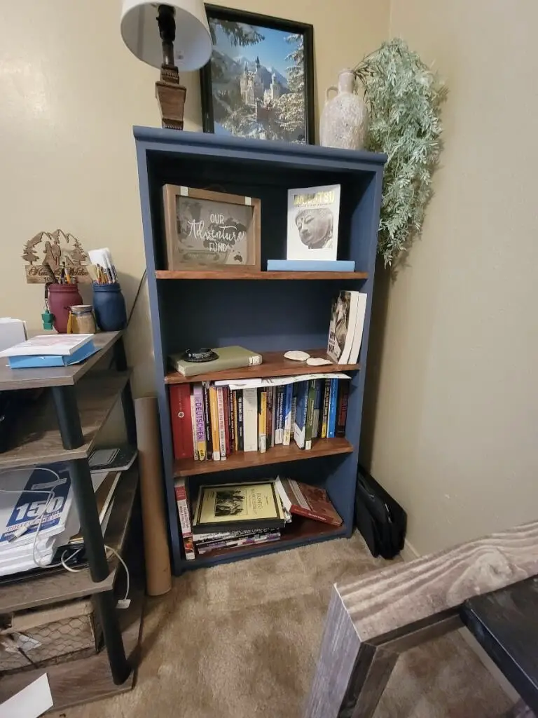 Blue bookcase with decor
