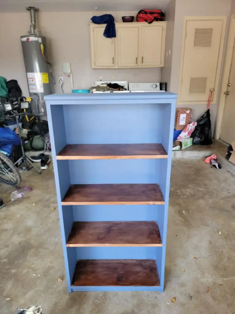 Blue book case with dark wood shelves