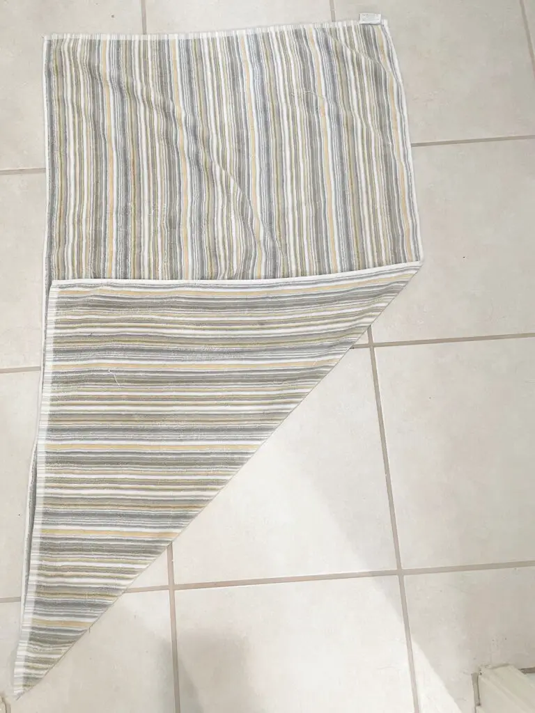 striped towel with a diagnol fold down the middle