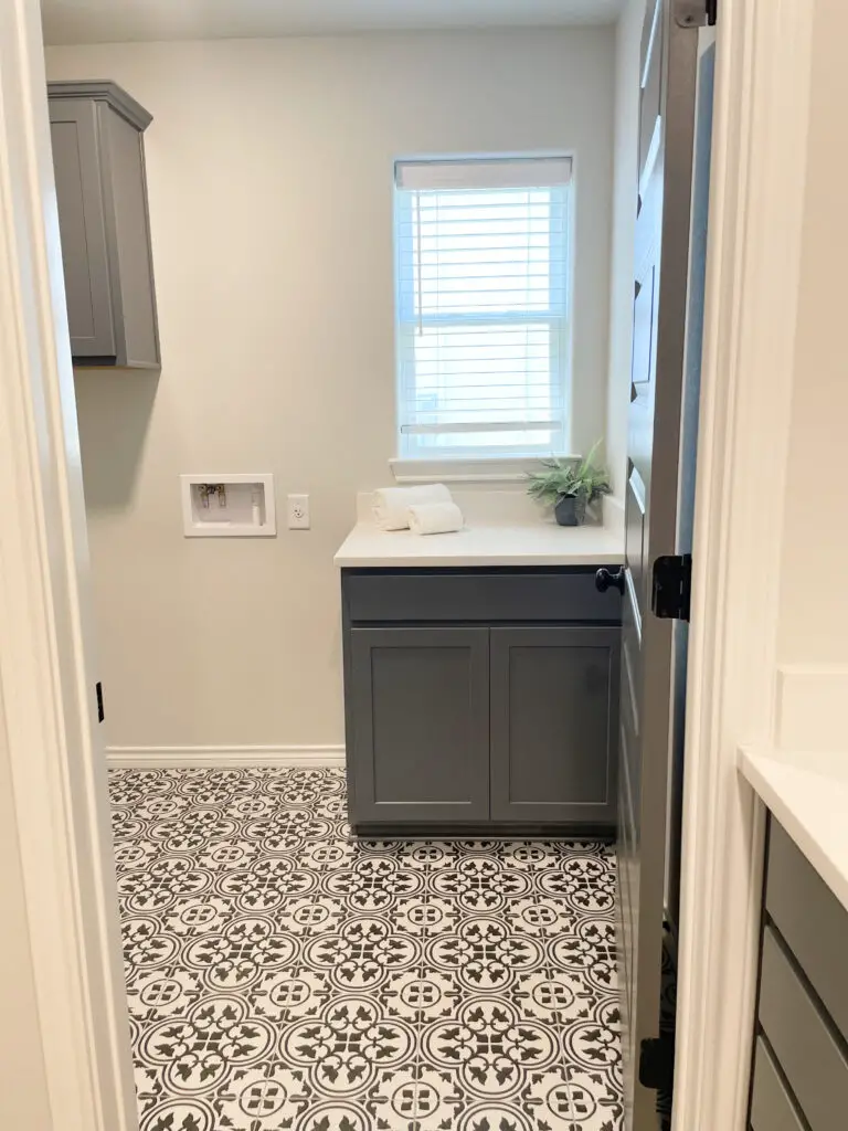 Bold white and black tile pattern on laundry room floor