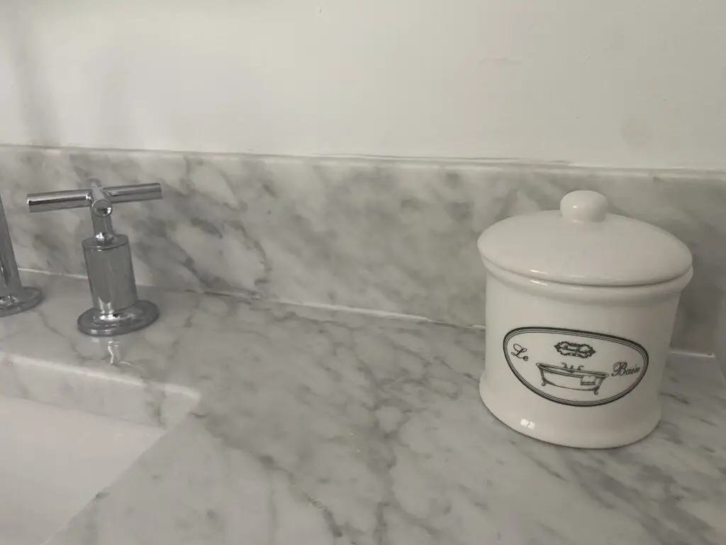 canister on marble countertop