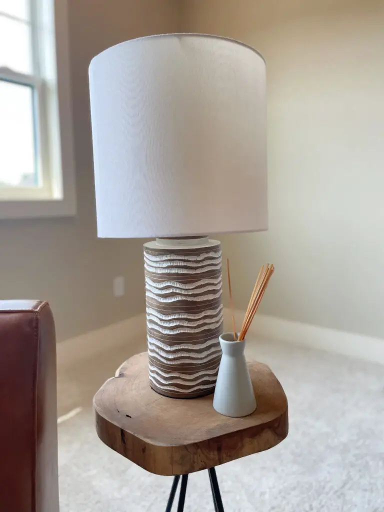 Bohemian lamp with scented stick diffuser on wood stump table top side table
