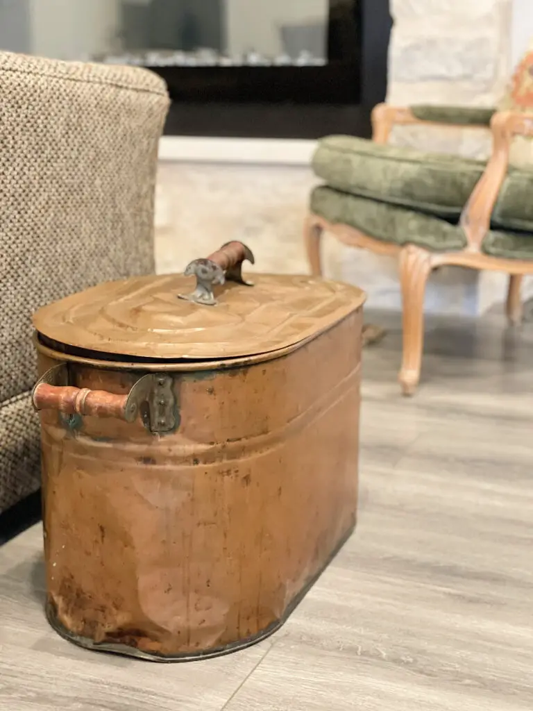 Rustic tin can next to new fireplace and couch