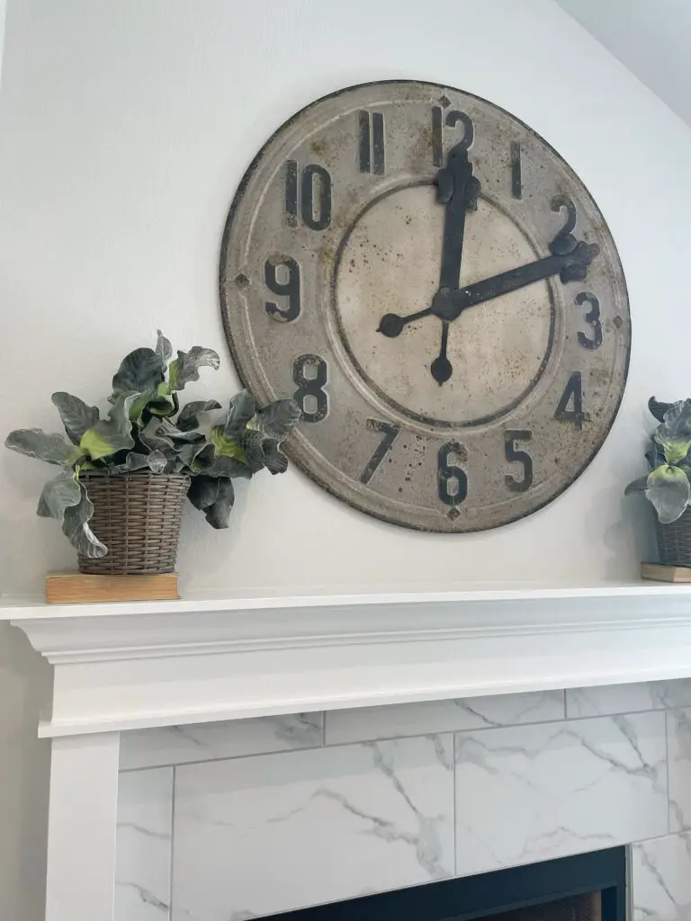 rustic clock above white mantle