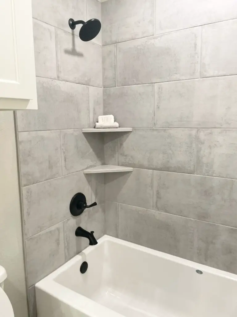 large scale concrete tile in half shower half bath