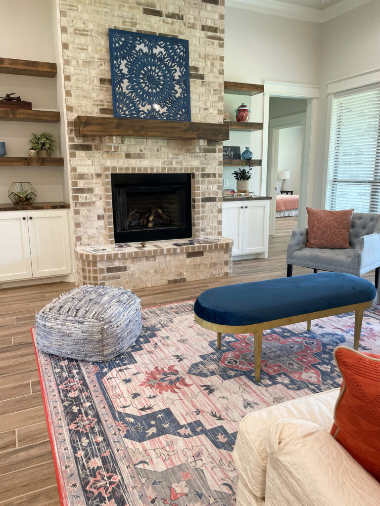 curated living room design with blues, blushes, and greens