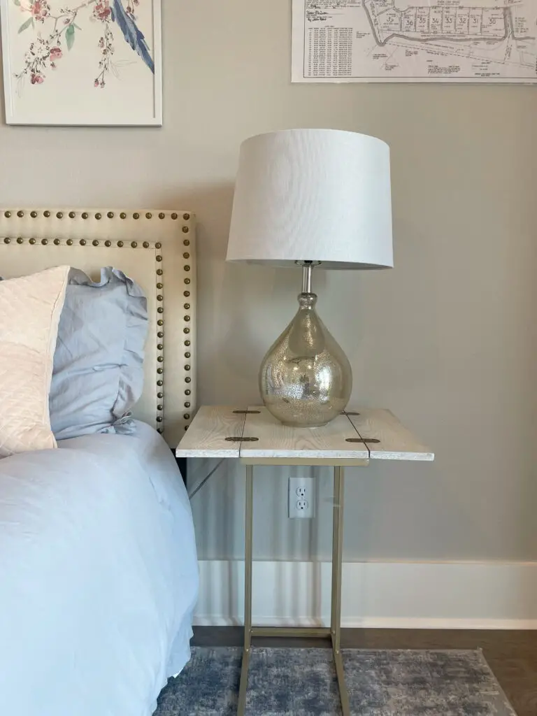 glam lamp on wooden and metal nightstand