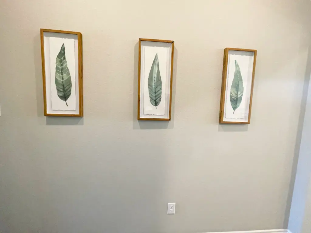 small wall art with leaves inside wooden glass frame