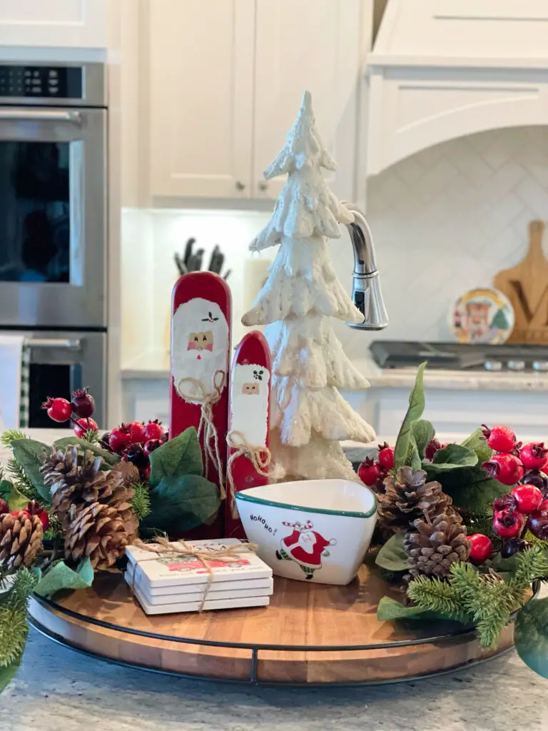 Christmas tray with small Santa sticks, a tree, bowl, and greens