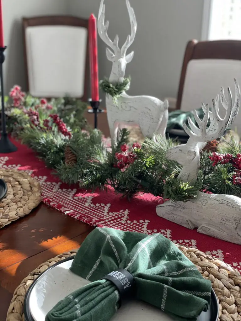 green napkins on Christmas table setting