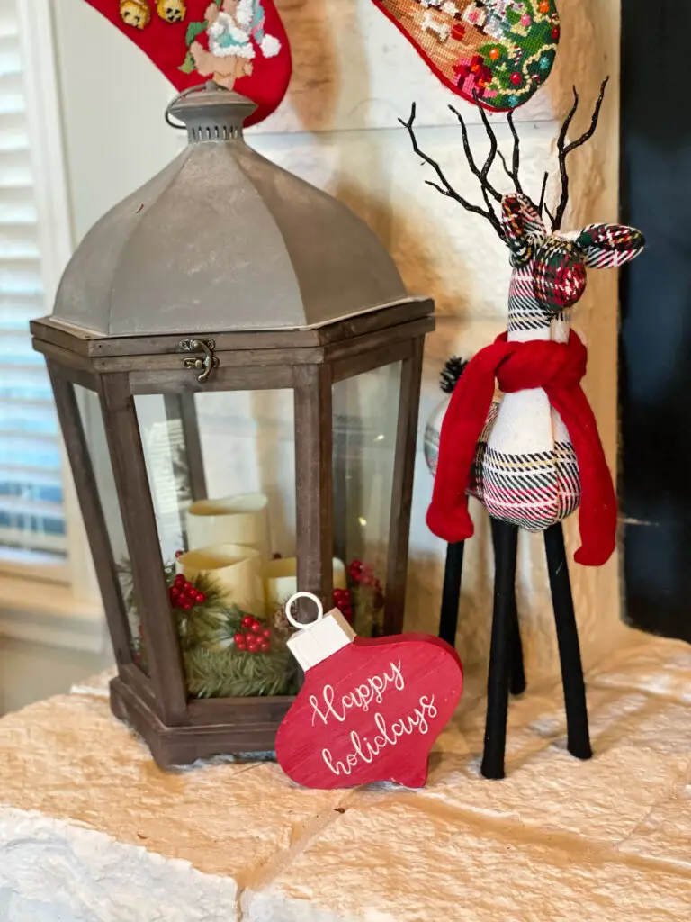 everyday decor on fireplace with Christmas accents added to it