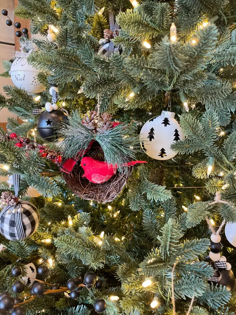 red, black, and white ornaments in a Christmas tree