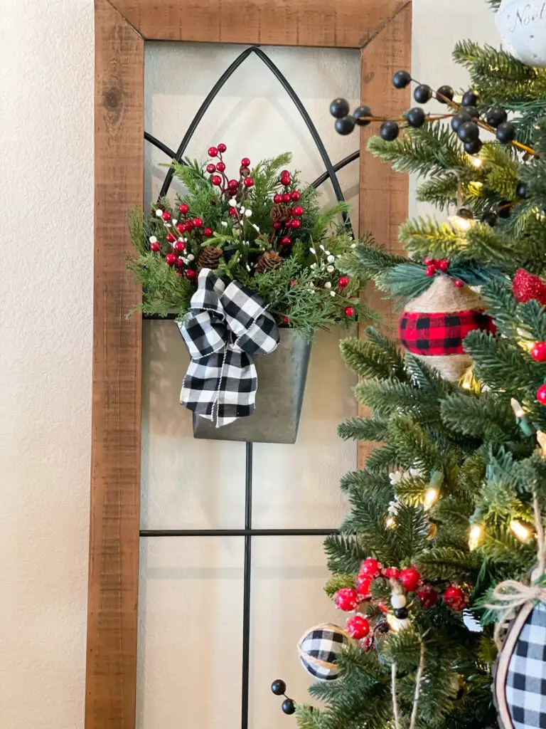 wood and metal wall decoration with Christmas tin decoration
