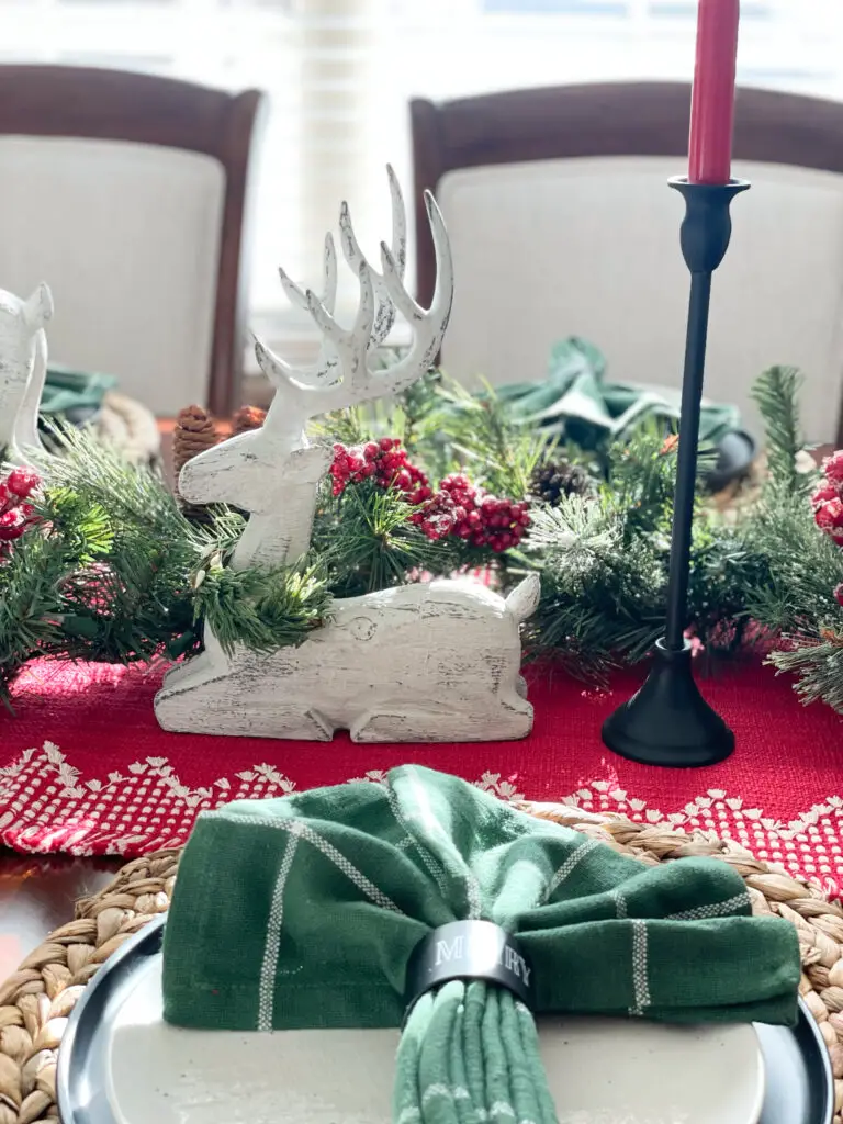 Green cloth napkins in Christmas table setting