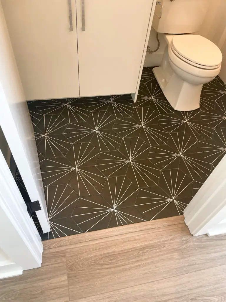geometric shaped tile floor in bathroom with bold, illusion pattern