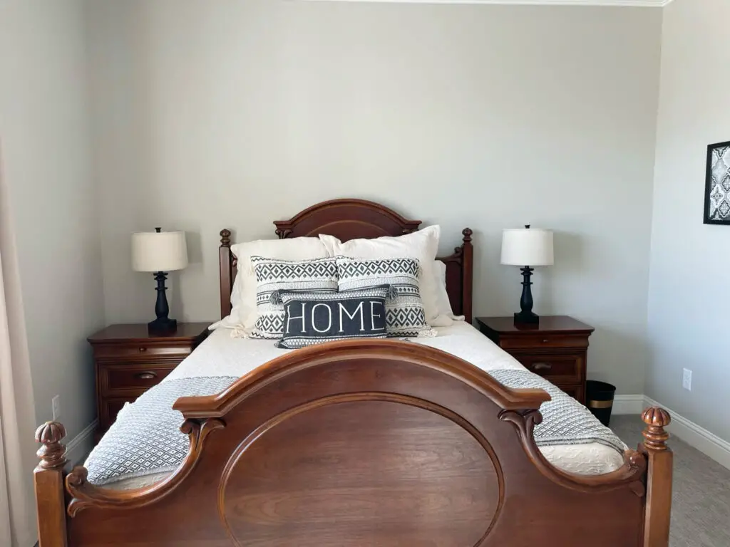 ornate wood bed frame and matching nightstands