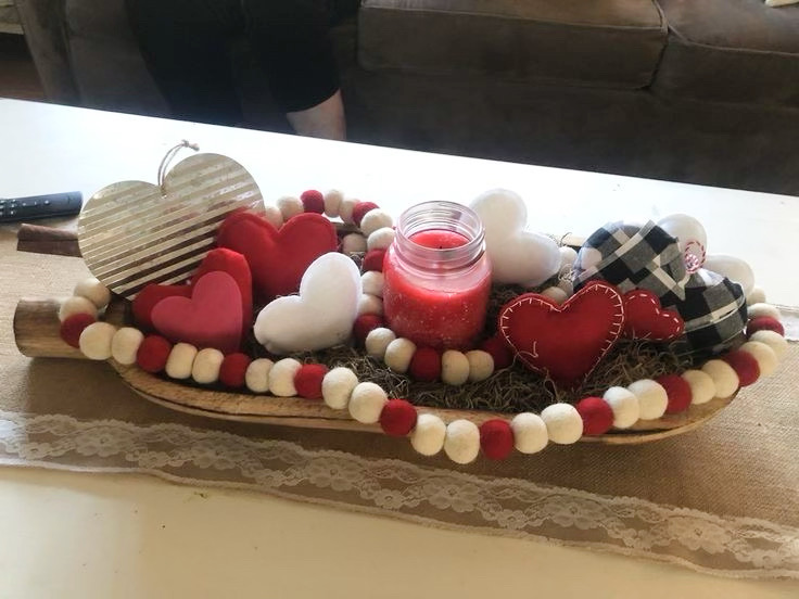Valentine's Day dough bowl with red and white beads draped inside of it