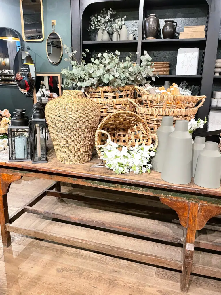 wicker basket and greenery display in farmhouse decor store