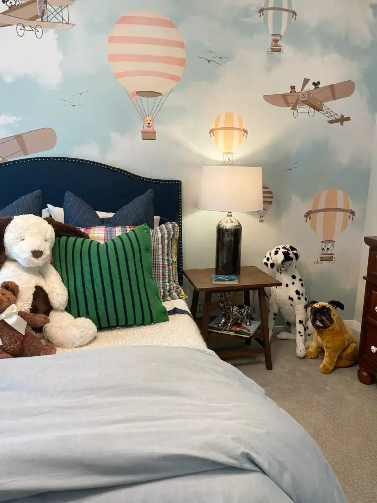 airplane and hot air balloon themed room with bold colors and stuffed animals